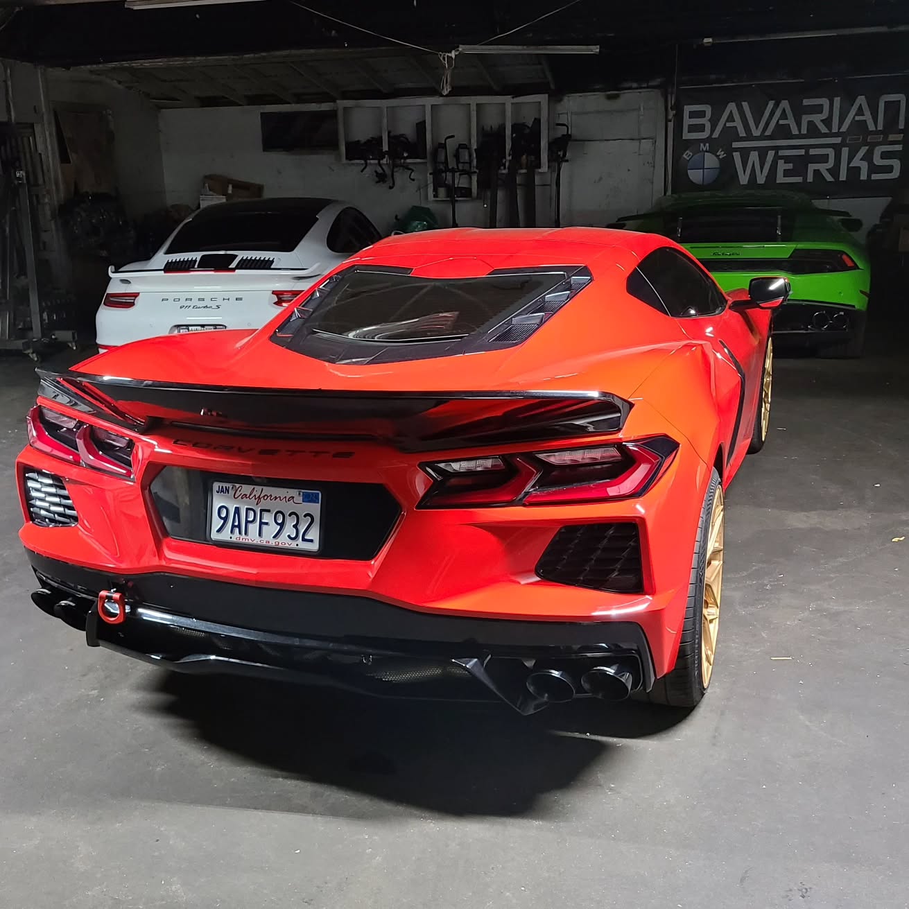 Professional BMW technicians consulting on diagnostic results with customer